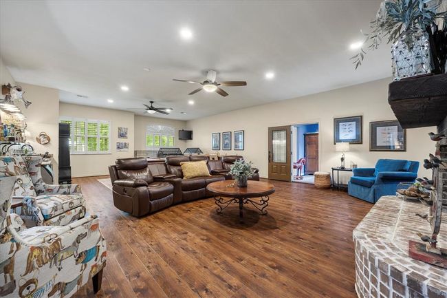 Living room with ceiling fan and dark hardwood / wood-style floors | Image 31