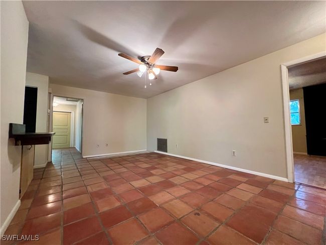 Unfurnished room with baseboards, tile patterned flooring, visible vents, and a ceiling fan | Image 35
