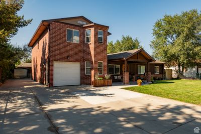 View of front of property with a garage and a front yard | Image 3