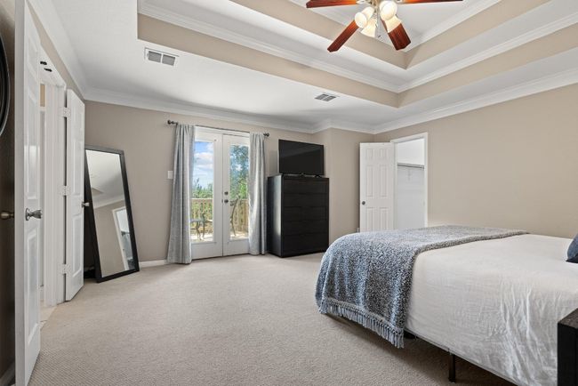 Large windows bring in the morning sun and frame peaceful greenbelt views, giving the room a calm, tucked-away feel that’s hard to find | Image 19