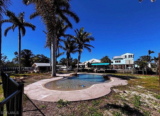 View of full swimming pool with fence | Image 21