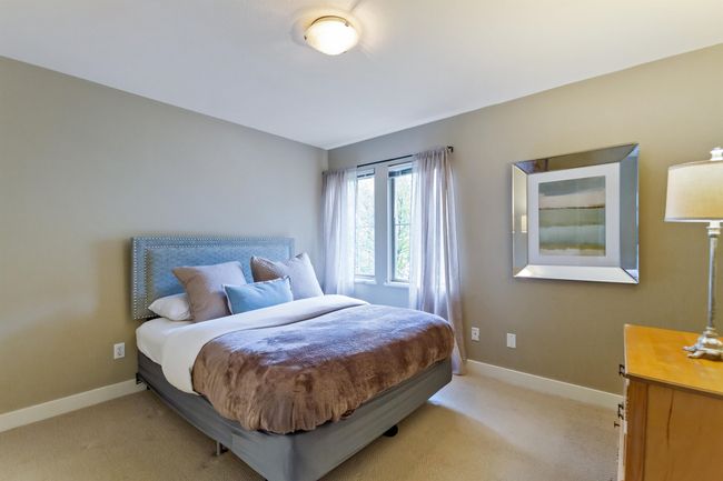 Bedroom with baseboards and light carpet | Image 22