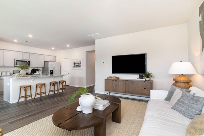 Living room with baseboards, dark wood-style floors, and recessed lighting | Image 10