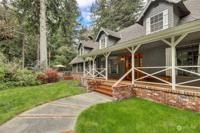 Porches extend around the home. | Image 3