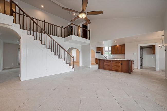 View from the fireplace back into the wide open floorplan. | Image 12