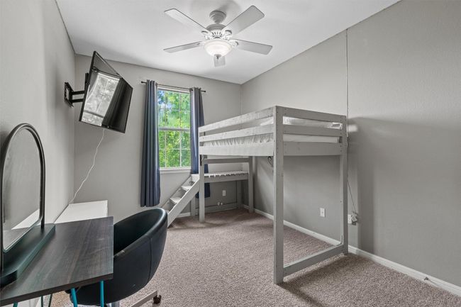 Secondary room with ceiling fan. | Image 28