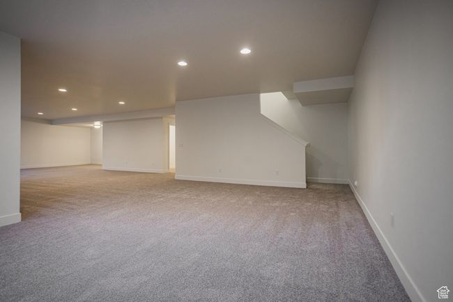 Bonus room with light colored carpet | Image 23