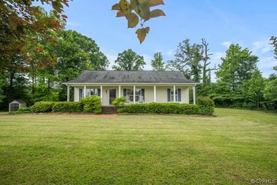 View of front of home featuring a front lawn and a porch | Image 2