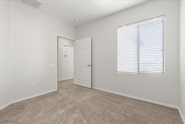 Carpeted empty room with baseboards | Image 28