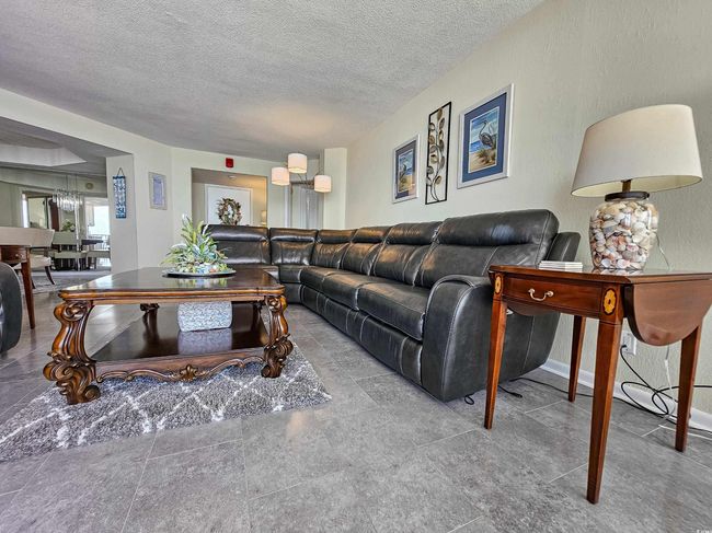 Living room featuring a textured ceiling | Image 7