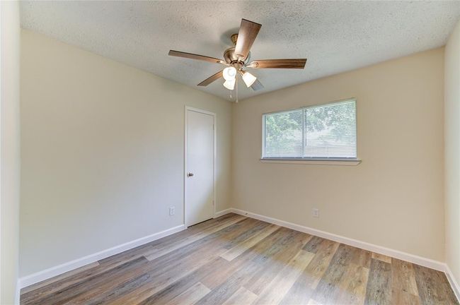 Bedroom 3. All bedrooms have blinds and new ceiling fans | Image 14