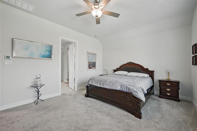 Carpeted bedroom with baseboards and a ceiling fan | Image 13