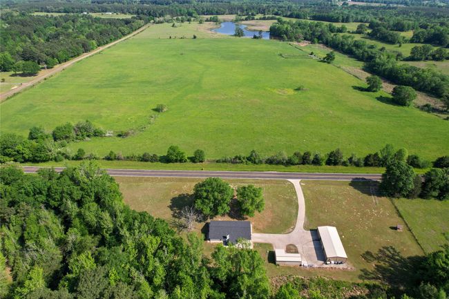 View of rural area with a nearby body of water | Image 5