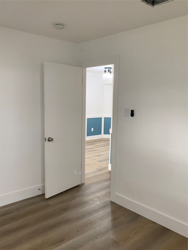 Unfurnished room featuring baseboards and dark wood finished floors | Image 17