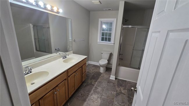2nd Floor Bathroom with toilet, baseboards, visible vents, and a sink | Image 41