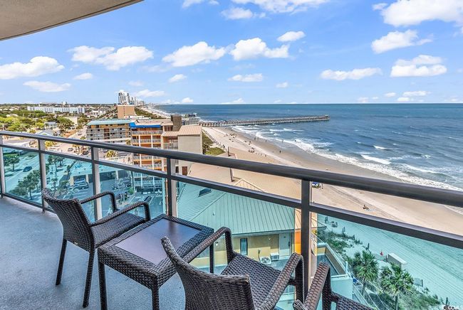 Balcony featuring a beach view and a water view | Image 32