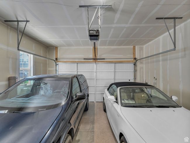Garage featuring a garage door opener | Image 24