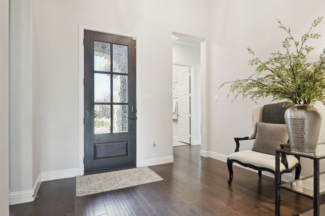 Foyer featuring plenty of natural light and dark wood-style floors | Image 5