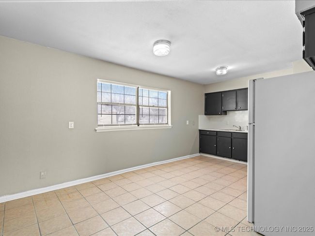 Kitchen, note the cabinets and the tile floor | Image 5