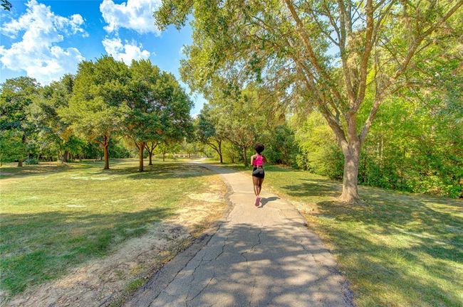 Just a short drive away, Terry Hershey Park offers over 500 acres of scenic green space, perfect for outdoor enthusiasts and nature lovers. With walking, jogging, and biking trails that wind along Buffalo Bayou, the park provides a peaceful escape just minutes from the home. Enjoy the tranquility of the natural surroundings, or take advantage of the park's amenities, including picnic areas and playgrounds. Terry Hershey Park is an ideal spot for recreation and relaxation, offering a beautiful outdoor retrea | Image 31
