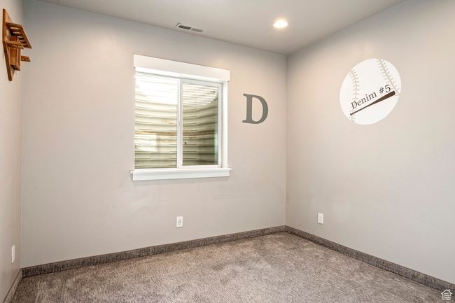 Empty room with visible vents, baseboards, recessed lighting, and carpet | Image 31