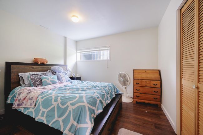 Bedroom with wood finished floors | Image 28