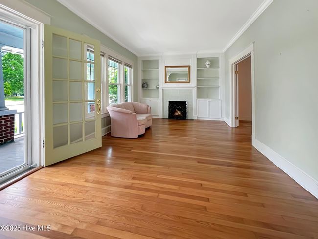 Spacious living room with direct access to covered front porch and adjoining dining room | Image 5
