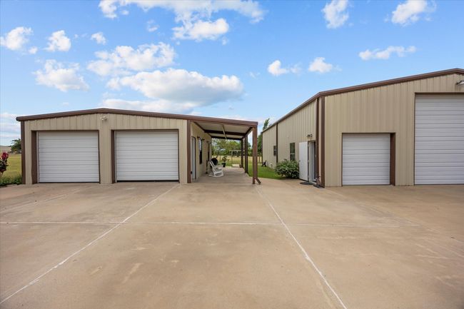 Garage with a detached garage | Image 19
