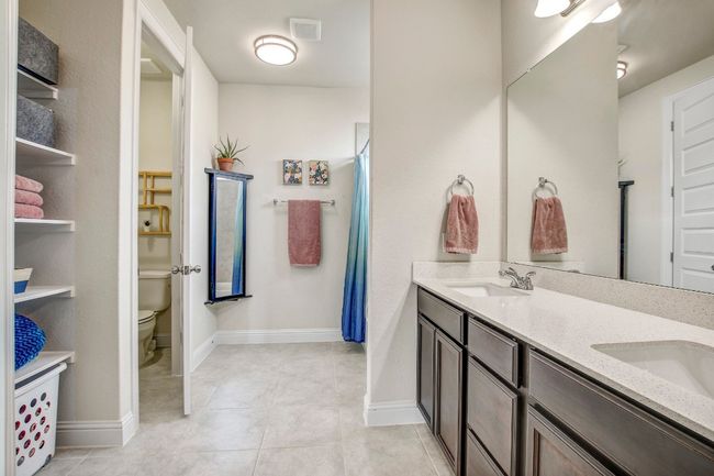 Bathroom featuring double vanity and tile patterned floors | Image 19