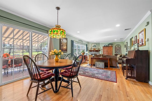 Sliding glass door to deck off of the dining area. | Image 9