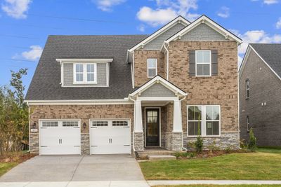 READY NOW!! The Kingston floorplan! Primary and study on main level with 3 beds & bonus upstairs. Photos of actual home. | Image 1