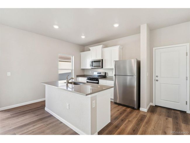 2986 Oxley St, House other with 2 bedrooms, 2 bathrooms and null parking in Strasburg CO | Image 4