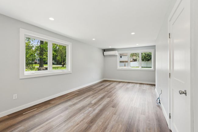 1st floor room AC /heat split mini , healthy amount of natural light, wood finished floors, and recessed lighting | Image 8