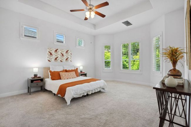 Windows surround the primary suite, including a bay window perfect for a sitting nook. | Image 20