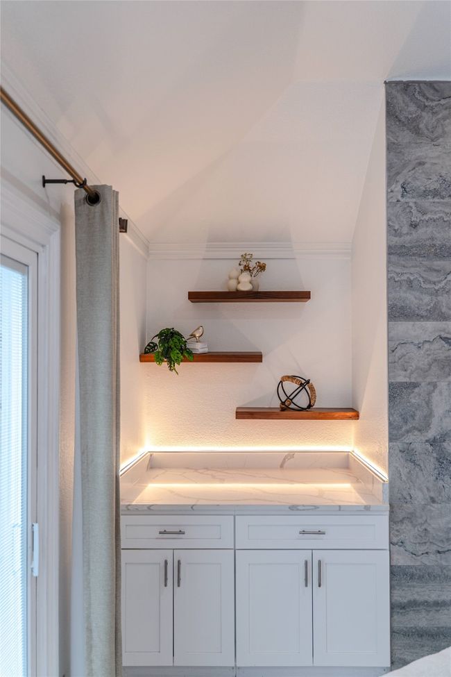 Bathroom with lofted ceiling, ornamental molding, and vanity | Image 23