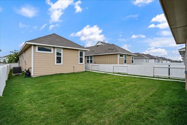 Back of property with a fenced backyard | Image 26