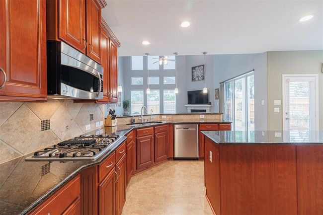 Kitchen features gas cooking. | Image 15