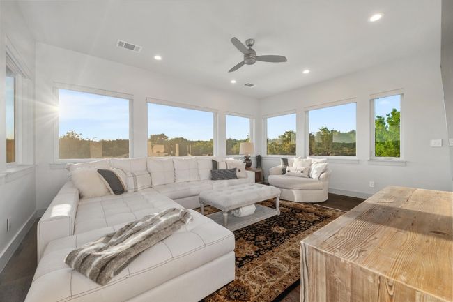 Living room featuring visible vents, baseboards, ceiling fan, dark wood-style floors, and recessed lighting | Image 22