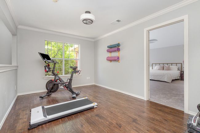Exercise area/Play room with hardwood flooring, open to foyer below | Image 16