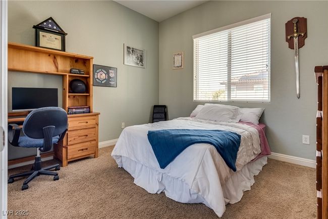 Carpeted bedroom with baseboards | Image 42