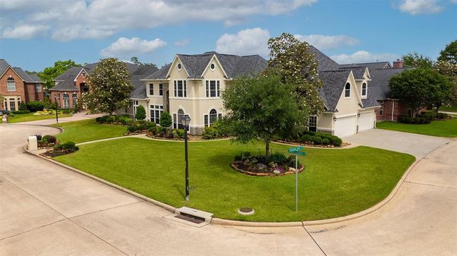 Perfectly positioned on a spacious corner lot, this home offers added privacy, presence, and curb appeal. With more yard space and fewer immediate neighbors, it's a setting that feels open, yet distinctly yours. | Image 7