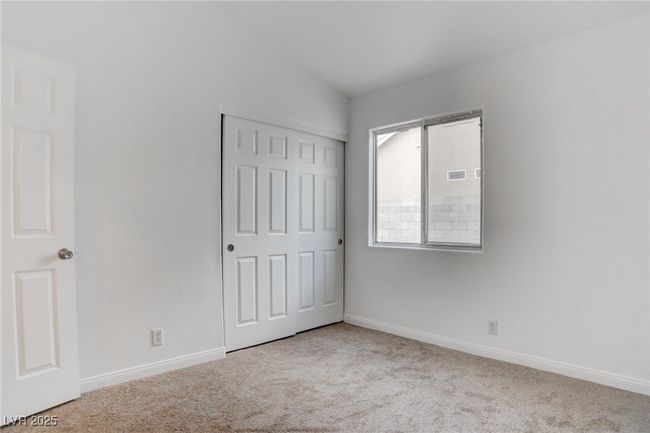 Bedroom with lofted ceiling, & a closet | Image 29