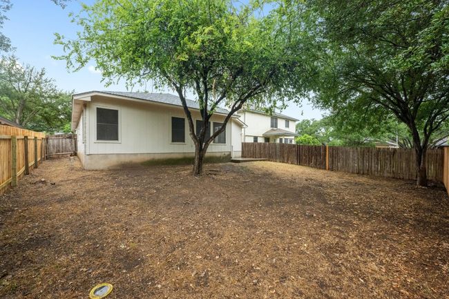 Back of property with a fenced backyard. | Image 23