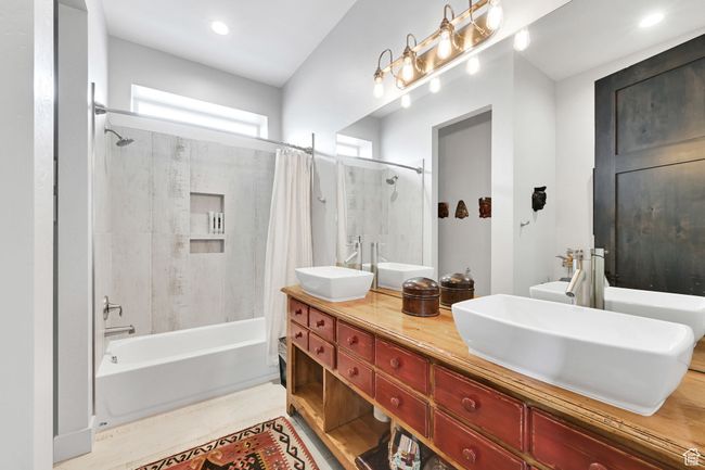Full bathroom with shower / bath combination with curtain and double vanity | Image 48