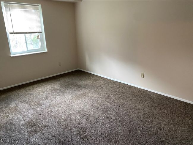 Carpeted spare room featuring baseboards | Image 10