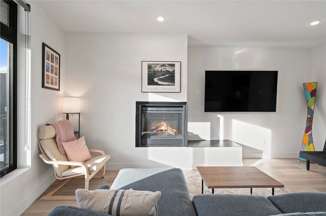 Living room featuring light hardwood / wood-style floors | Image 9