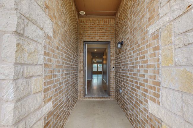 Property entrance featuring brick siding | Image 5