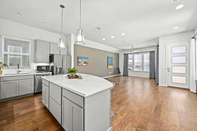 Kitchen featuring stainless steel appliances, gray cabinets, light countertops, and recessed​​‌​​​​‌​​‌‌​‌‌​​​‌‌​​‌‌​‌​​​​​‌ lighting | Image 14