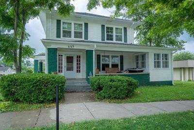 View of front of home featuring a front yard and covered porch | Image 2