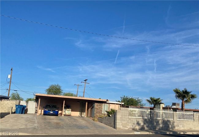 View of front facade featuring fence private yard, driveway, and a carport | Image 40